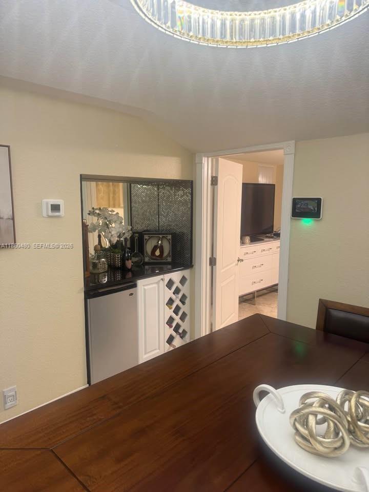 3781 Riedel Avenue Palm Springs, FL 33461 - Photo 13 of 25 a kitchen with a table and chairs