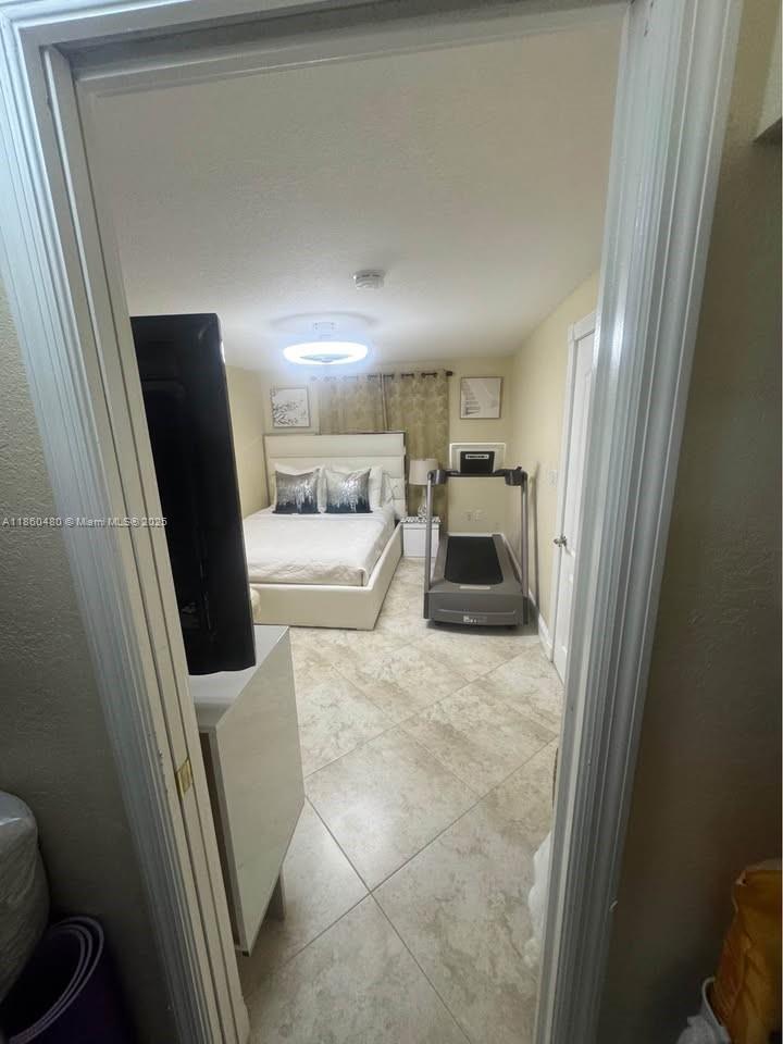 3781 Riedel Avenue Palm Springs, FL 33461 - Photo 14 of 21 a hallway with a couch