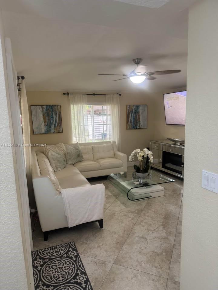3781 Riedel Avenue Palm Springs, FL 33461 - Photo 18 of 21 a living room with furniture and a window