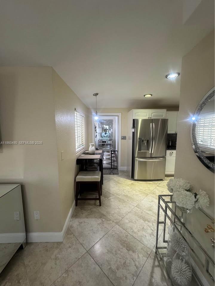 3781 Riedel Avenue Palm Springs, FL 33461 - Photo 20 of 25 a lobby with furniture and a table