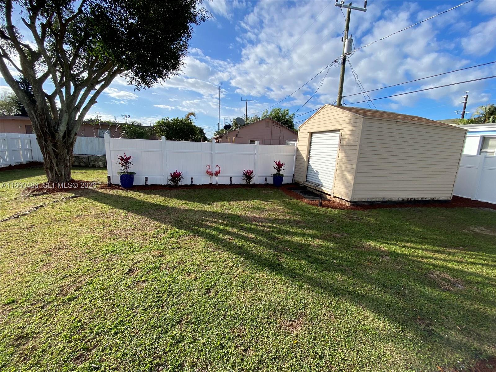 3781 Riedel Avenue Palm Springs, FL 33461 - Photo 22 of 25 a view of a backyard