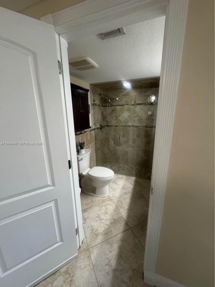 3781 Riedel Avenue Palm Springs, FL 33461 - Photo 10 of 25 a bathroom with a sink and toilet