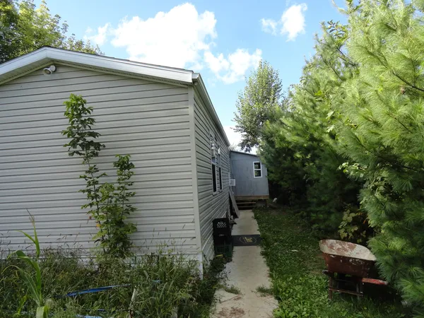 a backyard of a house with lots of green space