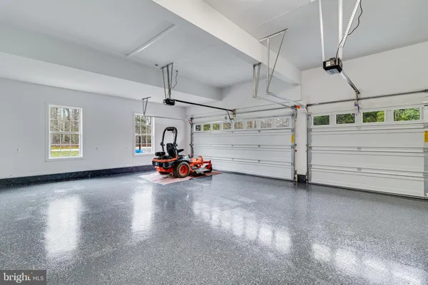 a view of staircase with railing and white walls