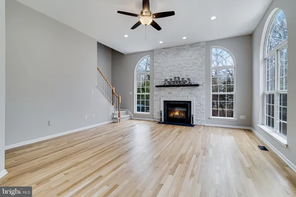a view of a kitchen with a sink and refrigerator