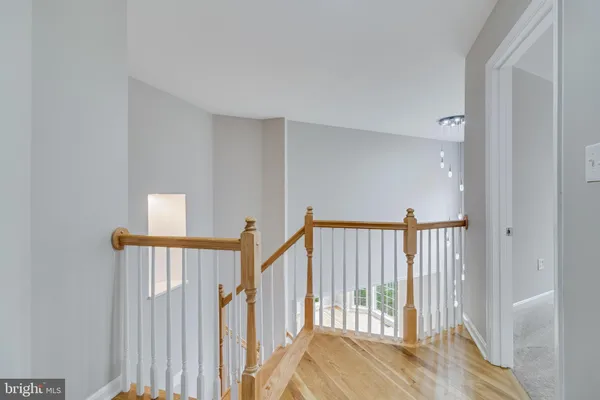 a view of an empty room with a ceiling fan