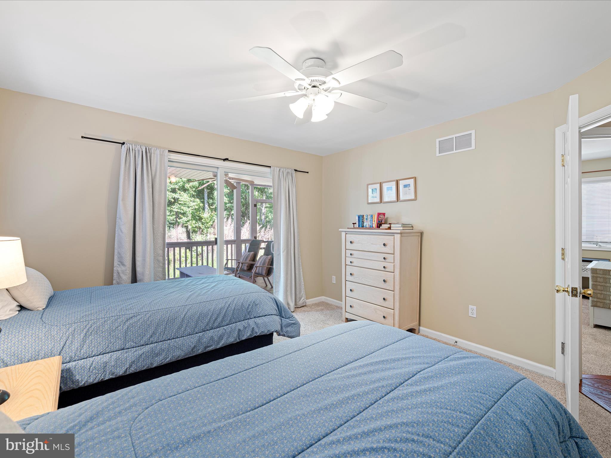 734 Deer Leap Drive, Unit 4 Bethany Beach, DE 19930 - Photo 44 of 53 Guest bedroom 4 with with covered deck access