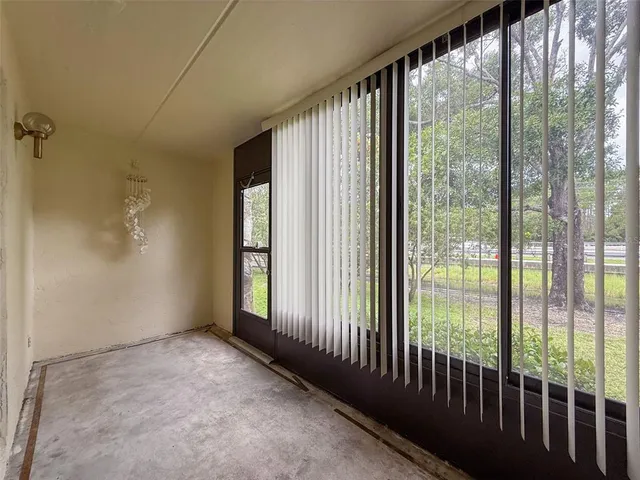 a view of a room with sliding glass door