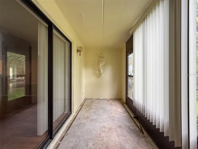 a view of a hallway with a wooden door