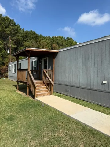 a view of a house with wooden floor and a outdoor space