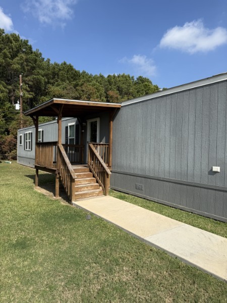 20410 Telge Road, Unit 11 Tomball, TX 77377 - Photo 1 of 30 a view of a house with wooden floor and a outdoor space