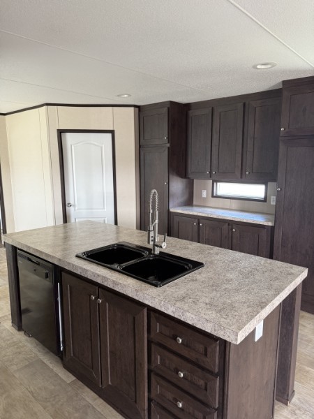 20410 Telge Road, Unit 11 Tomball, TX 77377 - Photo 15 of 30 a kitchen with a sink a cabinets and wooden floor