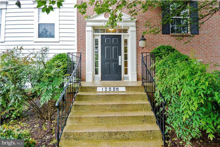 12009 Golf Ridge Court, Unit 202 Fairfax, VA 22033 - Photo 1 of 30 a view of fountain in front of house