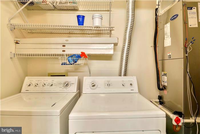 12009 Golf Ridge Court, Unit 202 Fairfax, VA 22033 - Photo 19 of 30 a utility room with dryer and washer