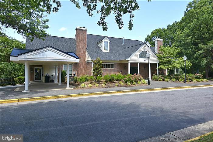 12009 Golf Ridge Court, Unit 202 Fairfax, VA 22033 - Photo 21 of 30 a front view of a house with a yard and porch