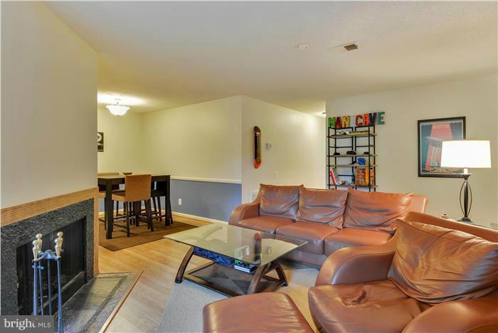 12009 Golf Ridge Court, Unit 202 Fairfax, VA 22033 - Photo 6 of 30 a living room with furniture and a table
