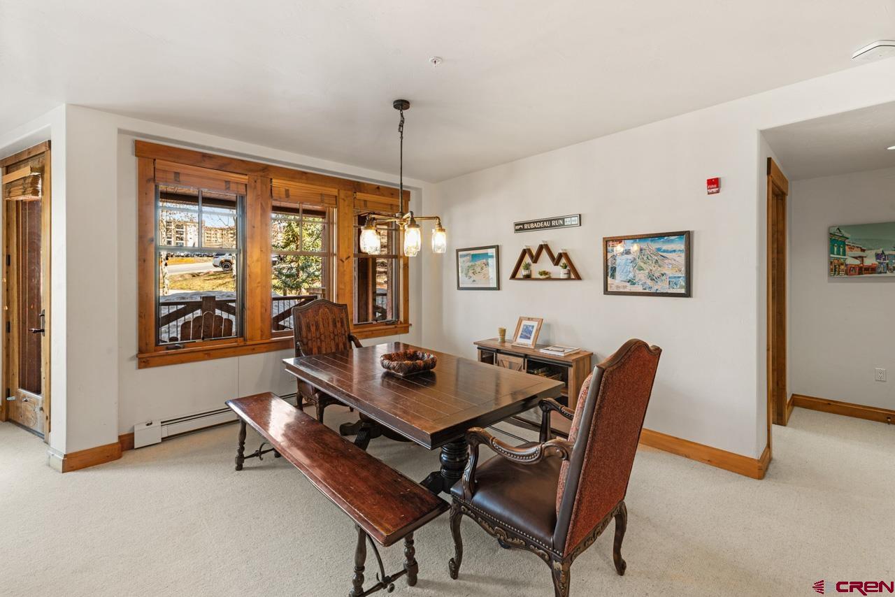 14 Hunter Hill Road, Unit A208 Crested Butte, CO 81225 - Photo 16 of 43 a dining room with furniture and window