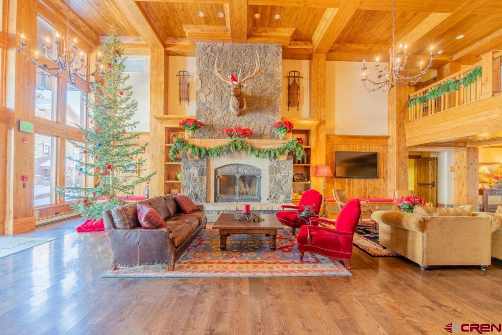 14 Hunter Hill Road, Unit A208 Crested Butte, CO 81225 - Photo 17 of 35 a living room with furniture fireplace and a flat screen tv