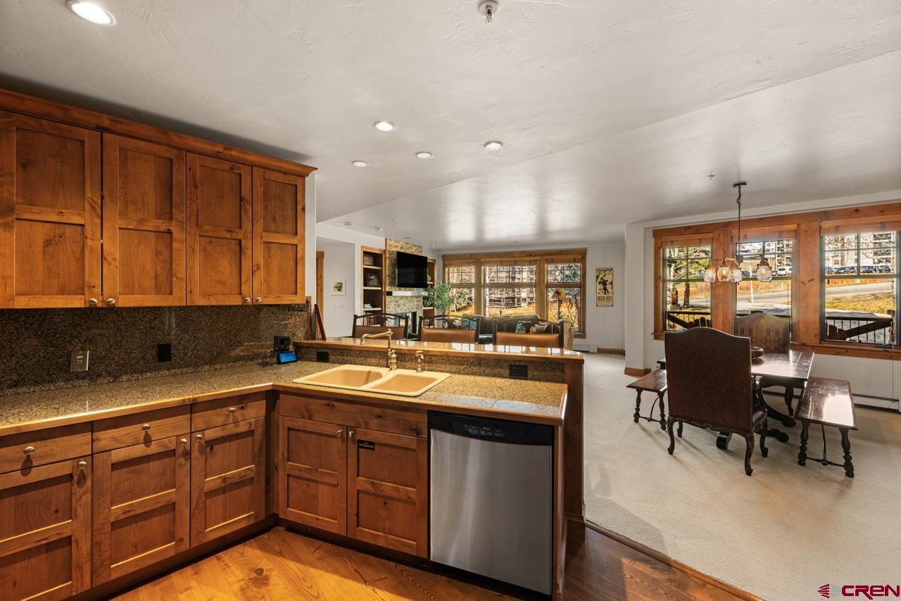 14 Hunter Hill Road, Unit A208 Crested Butte, CO 81225 - Photo 25 of 43 a kitchen with a sink and cabinets