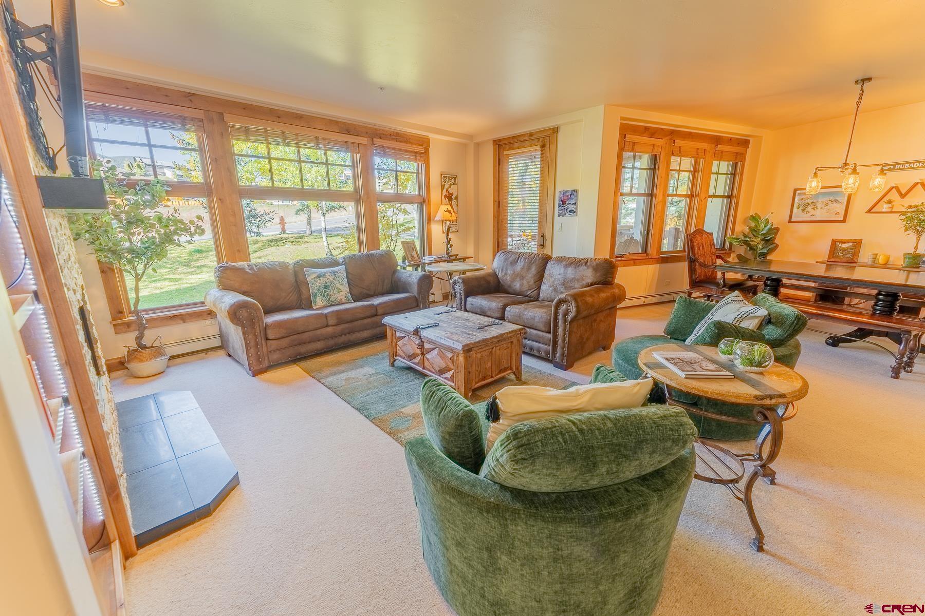 14 Hunter Hill Road, Unit A208 Crested Butte, CO 81225 - Photo 27 of 35 a living room with furniture and a large window