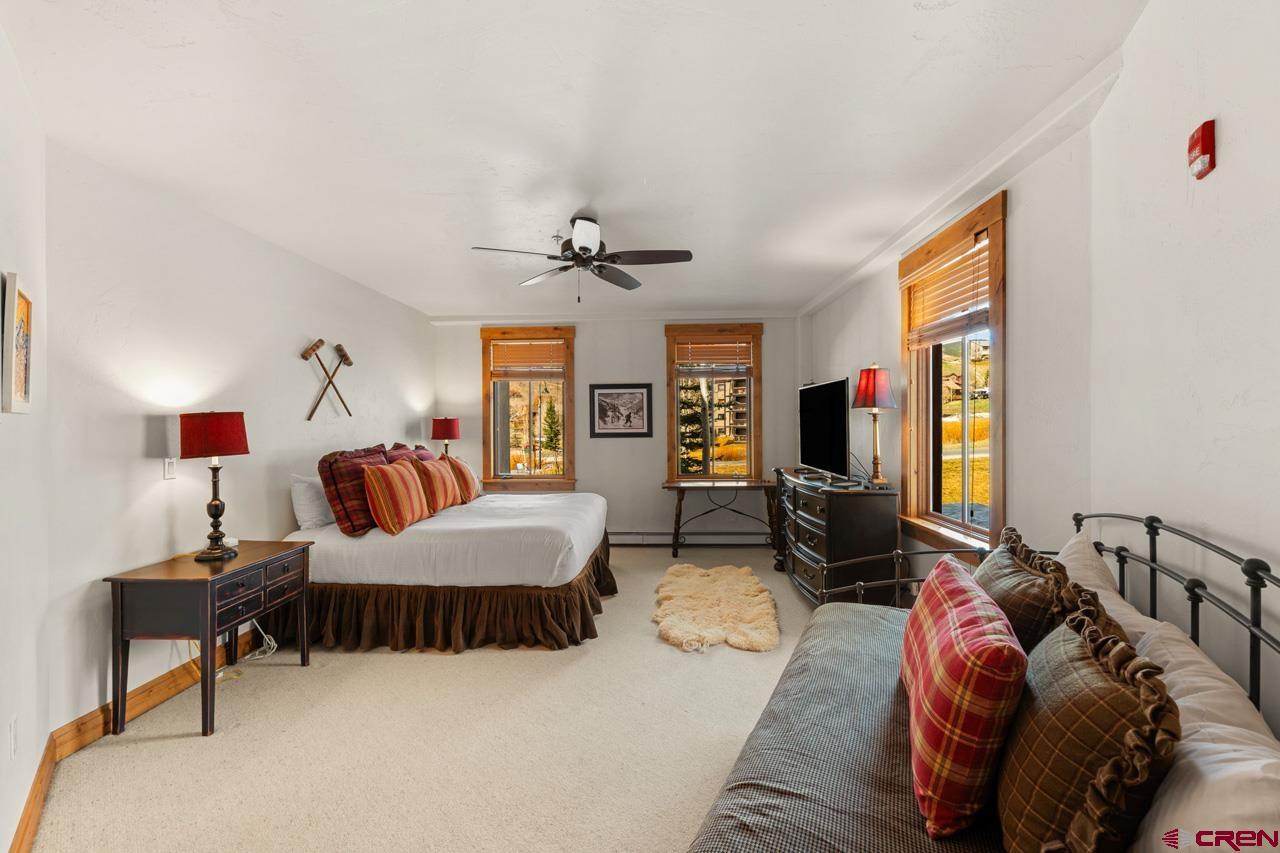 14 Hunter Hill Road, Unit A208 Crested Butte, CO 81225 - Photo 30 of 43 a living room with furniture and a flat screen tv