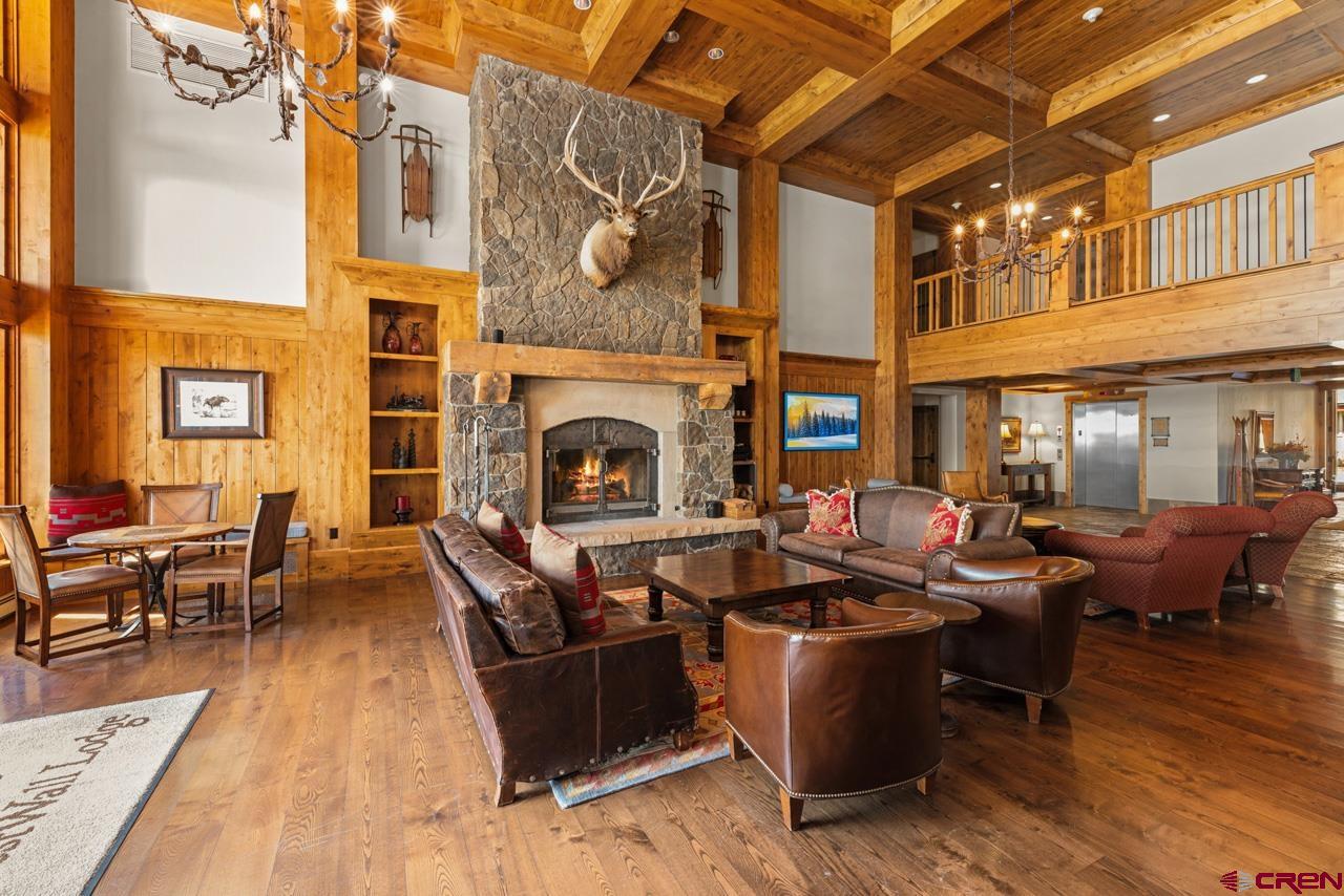 14 Hunter Hill Road, Unit A208 Crested Butte, CO 81225 - Photo 37 of 43 a living room with patio furniture and a fireplace