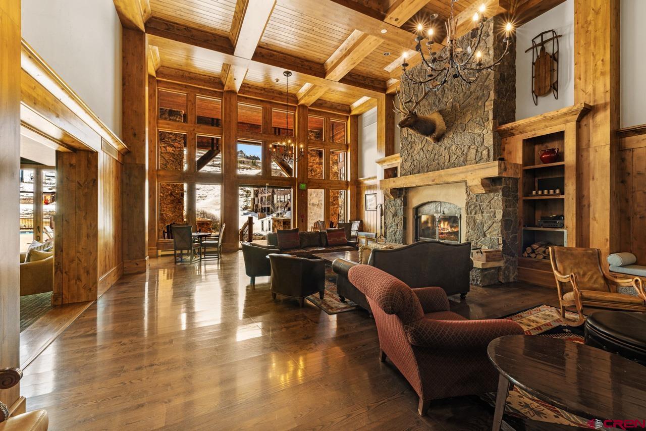 14 Hunter Hill Road, Unit A208 Crested Butte, CO 81225 - Photo 38 of 43 a living room with fireplace furniture and a floor to ceiling window