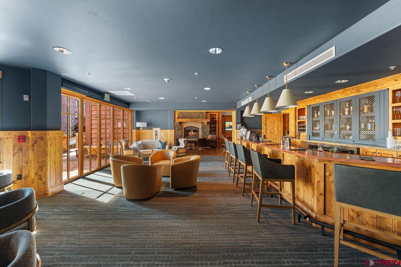 14 Hunter Hill Road, Unit A208 Crested Butte, CO 81225 - Photo 39 of 43 a living room with lots of furniture and a large window