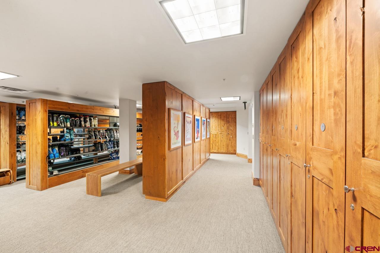 14 Hunter Hill Road, Unit A208 Crested Butte, CO 81225 - Photo 42 of 43 a view of a hallway with wooden floor and door
