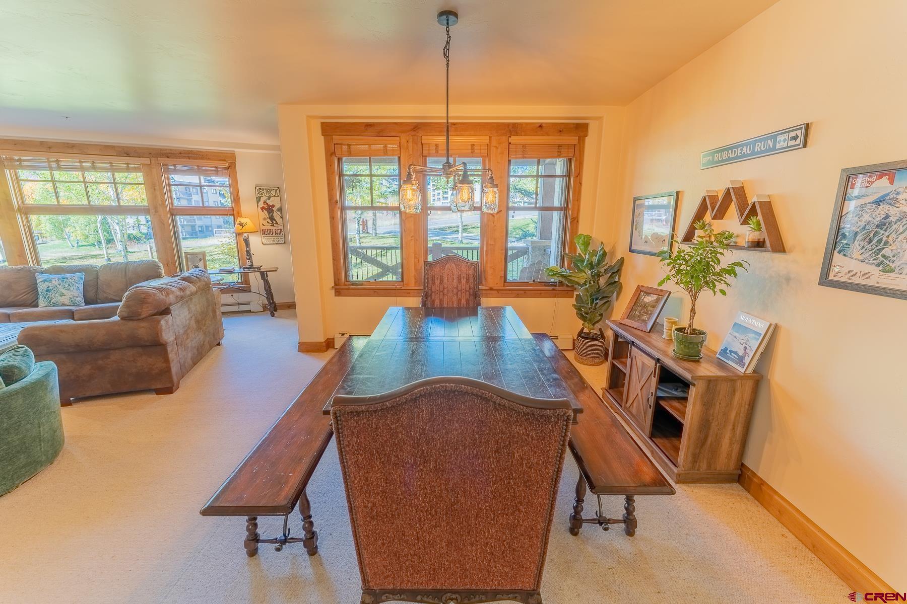 14 Hunter Hill Road, Unit A208 Crested Butte, CO 81225 - Photo 9 of 35 a living room with furniture and a large window
