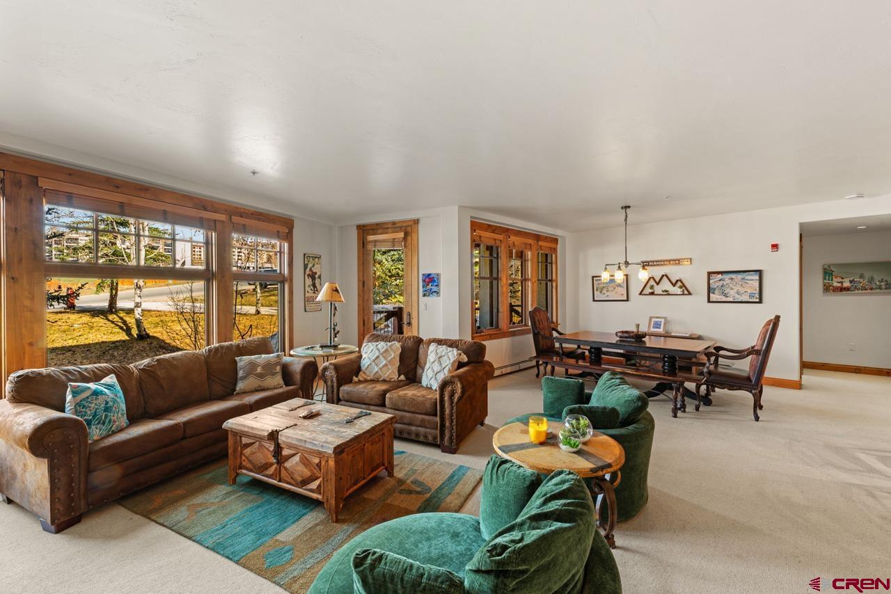 14 Hunter Hill Road, Unit A208 Crested Butte, CO 81225 - Photo 9 of 43 a living room with furniture and a large window