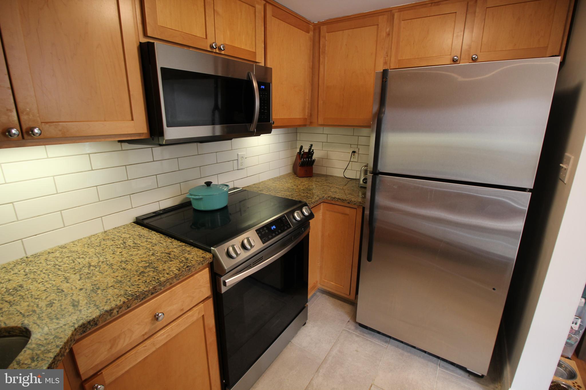 2630 Adams Mill Road Northwest, Unit 108 Washington, DC 20009 - Photo 6 of 16 Updated stove, microwave and refrigerator