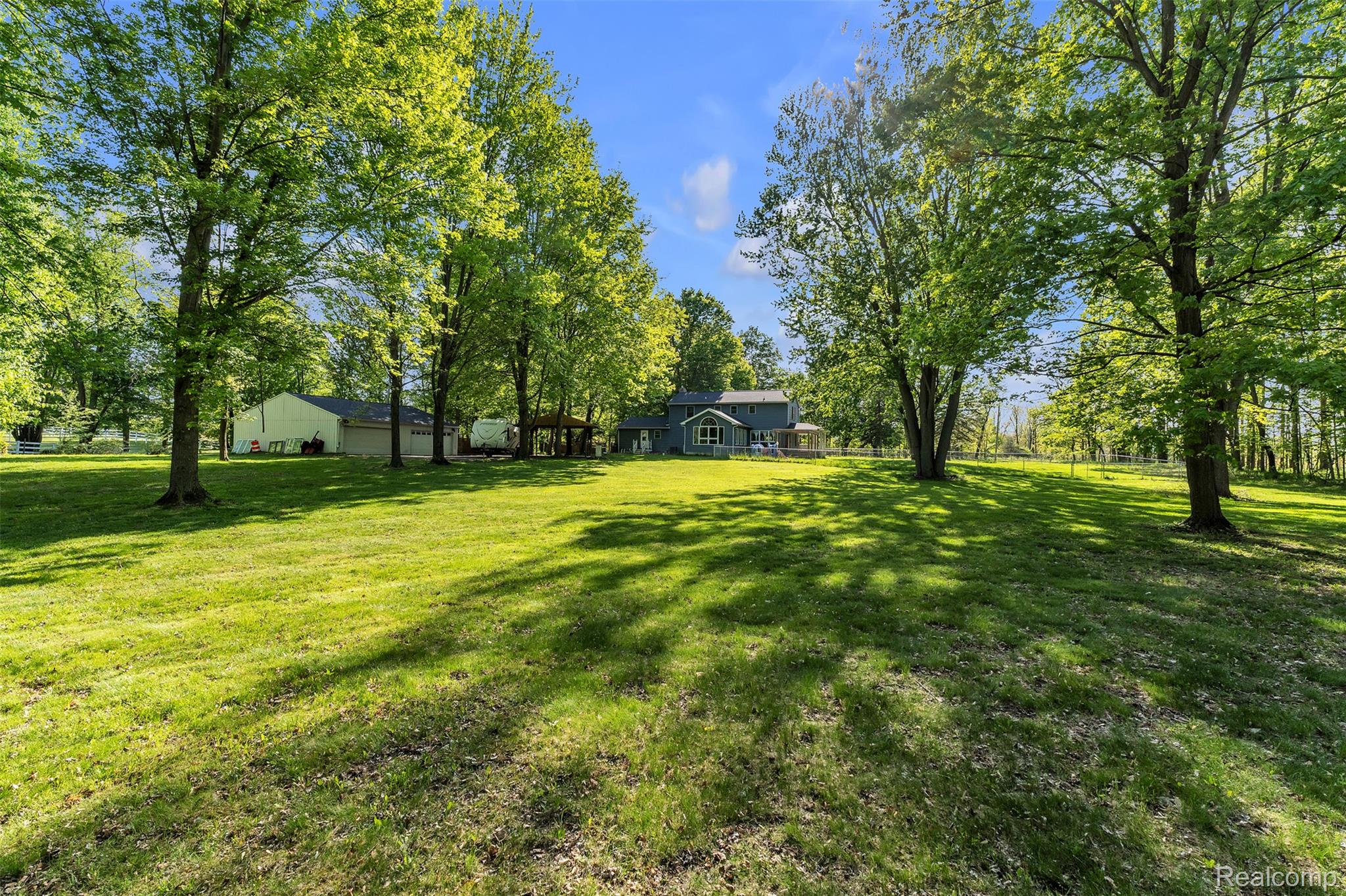 1345 Ives Road Mason, MI 48854 - Photo 74 of 92 View of yard featuring view of wooded area