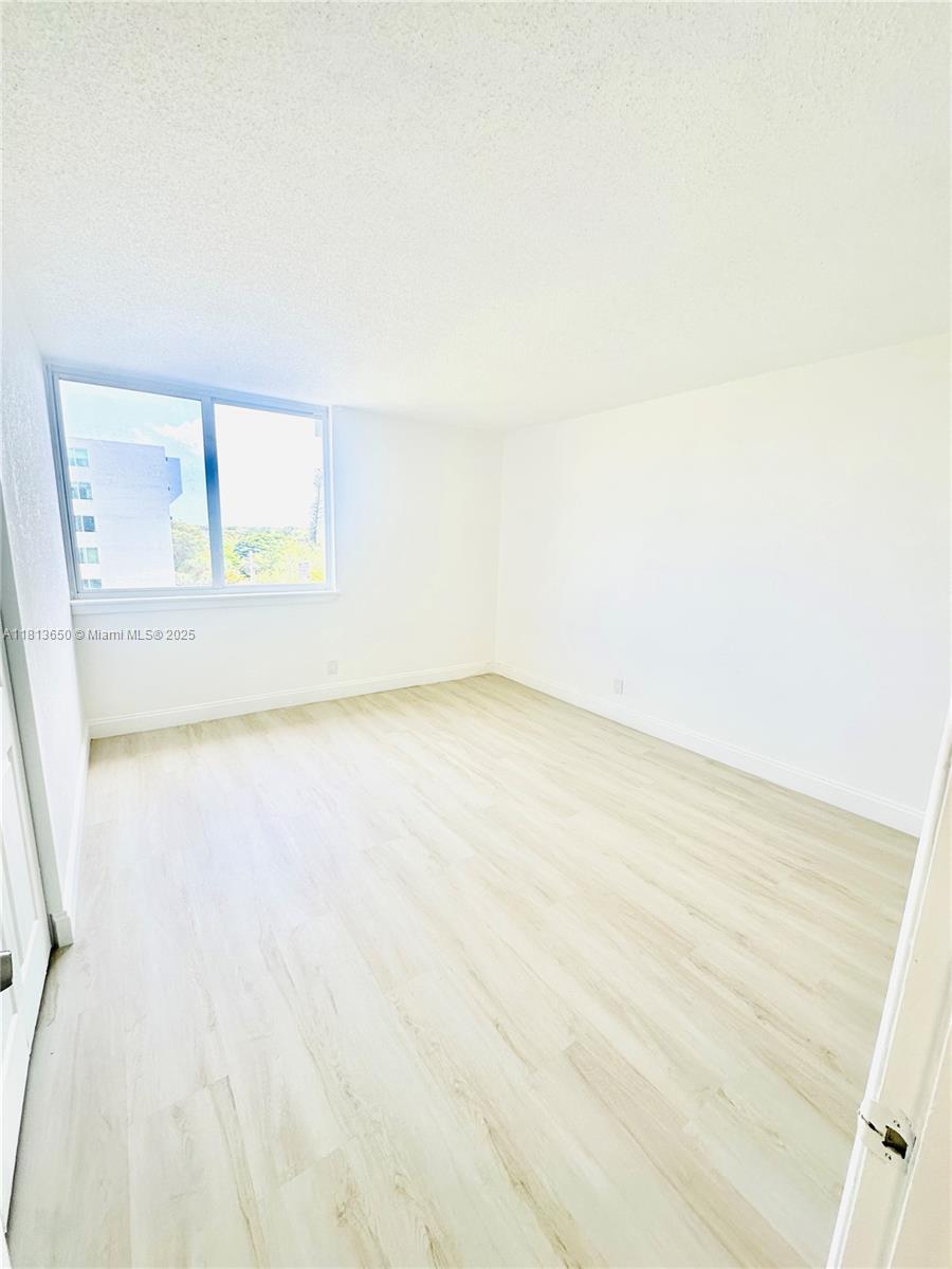 9001 Southwest 77th Avenue, Unit C608 Miami, FL 33156 - Photo 11 of 15 a view of an empty room