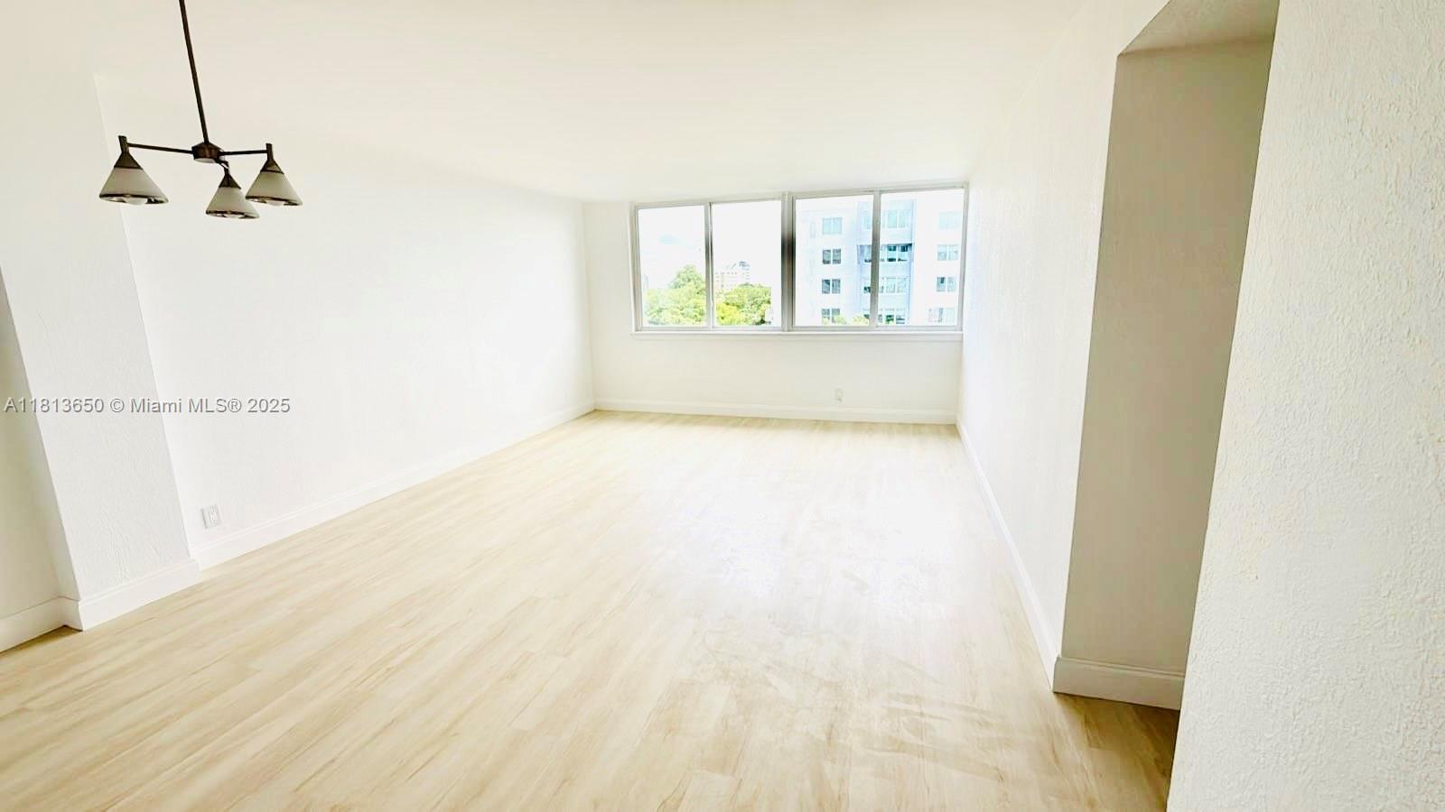 9001 Southwest 77th Avenue, Unit C608 Miami, FL 33156 - Photo 3 of 15 a view of an empty room with a window