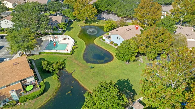 view of a house with a yard and garden