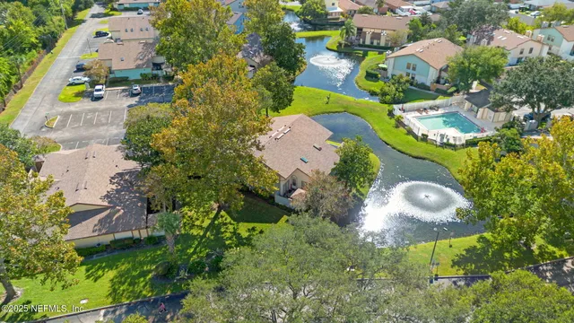 an aerial view of residential houses with outdoor space