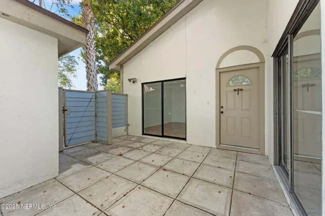 a view of a brick house with a large windows