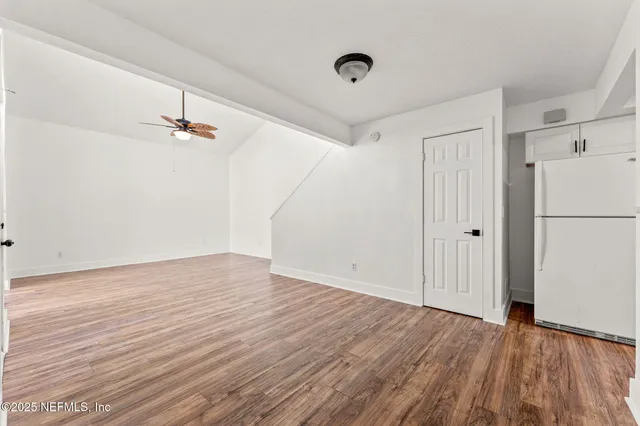 a view of a hardwood floor in a house