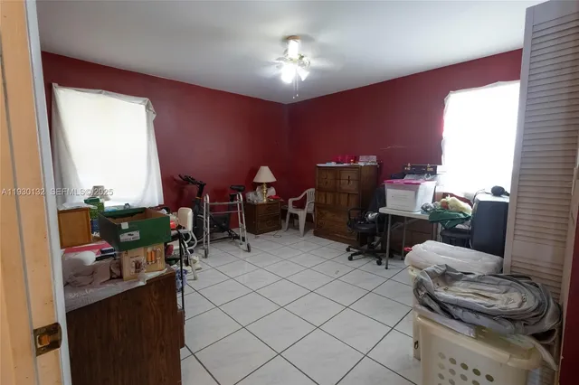 a living room with furniture a fireplace and a window