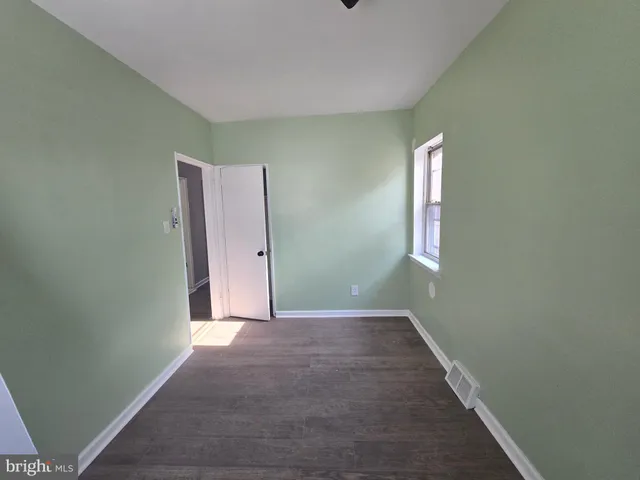 a bathroom with a sink toilet and a mirror