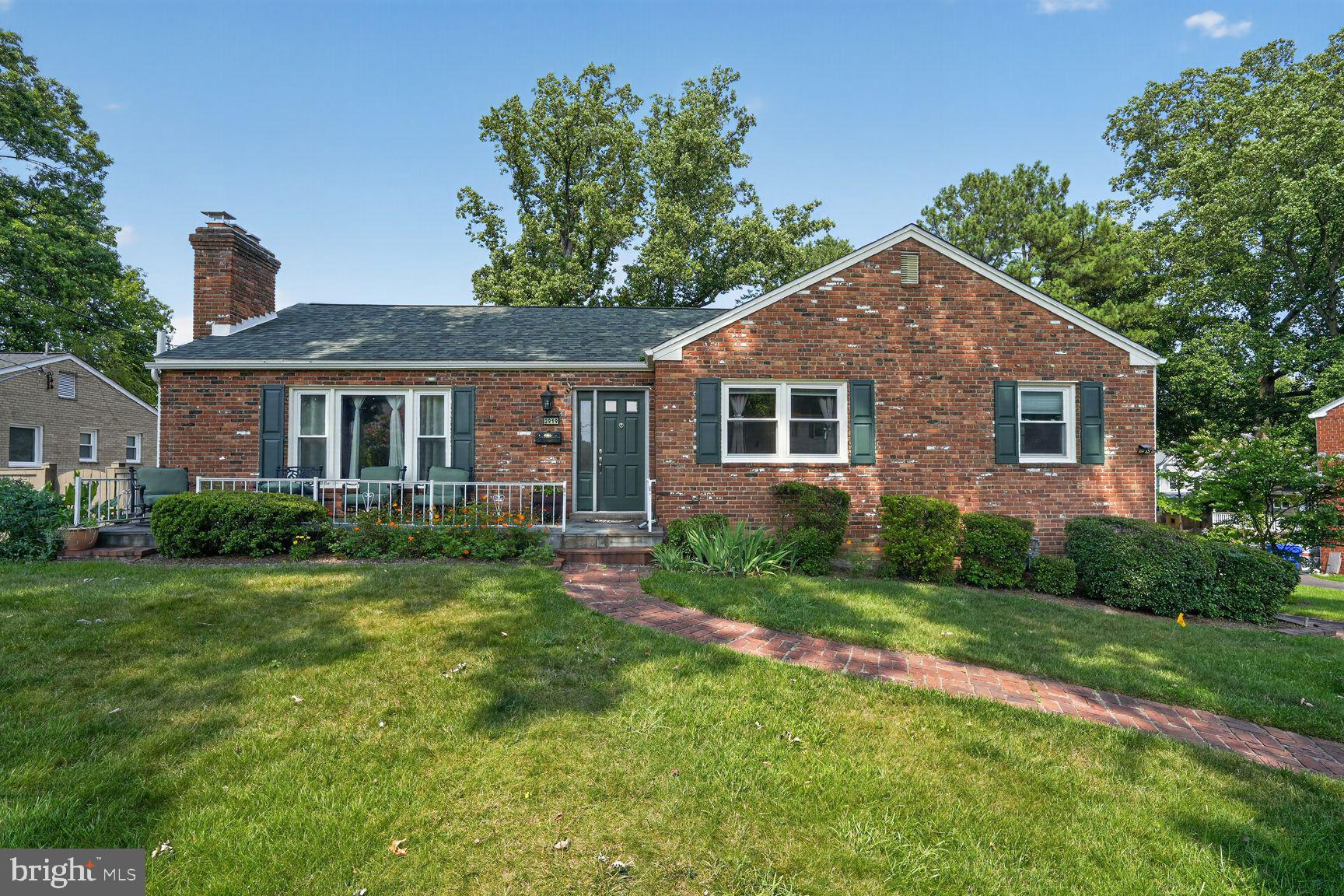 3919 Chesterbrook Road Arlington, VA 22207 - Photo 2 of 26 a front view of a house with a yard