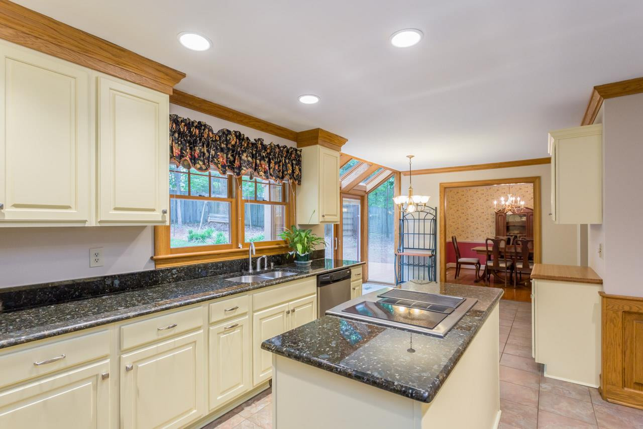 5200 Country Trail Raleigh, NC 27613 - Photo 6 of 25 The work has been done for you: recently renovated kitchen included new flooring, new counter tops and cabinets, Jenn-Air Gourmet Cooktop in island. Kitchen