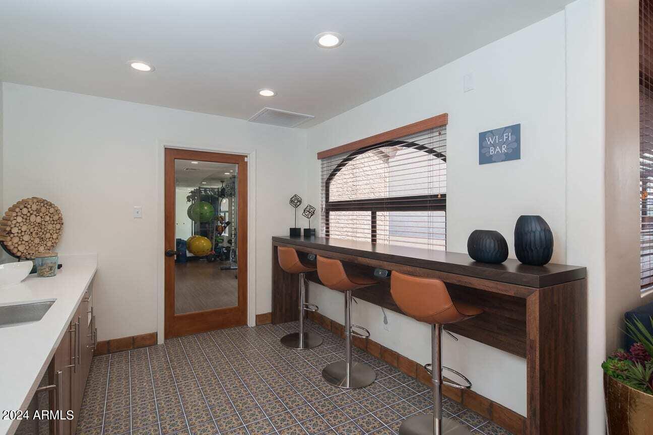 242 South Beck Avenue, Unit 1 Tempe, AZ 85281 - Photo 8 of 10 a bedroom with furniture and a window