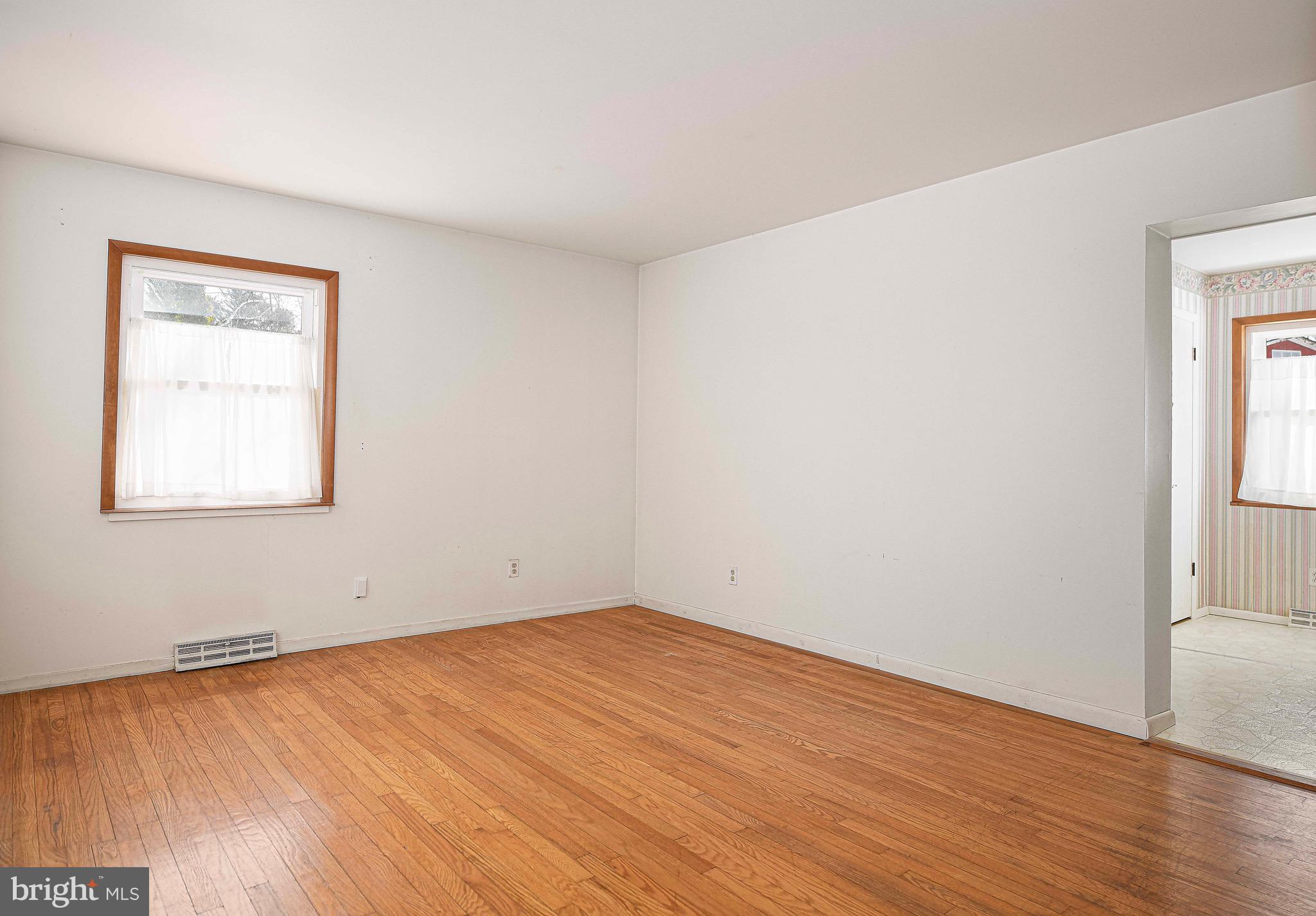 103 Chatham Road Bel Air, MD 21014 - Photo 12 of 21 an empty room with wooden floor and windows