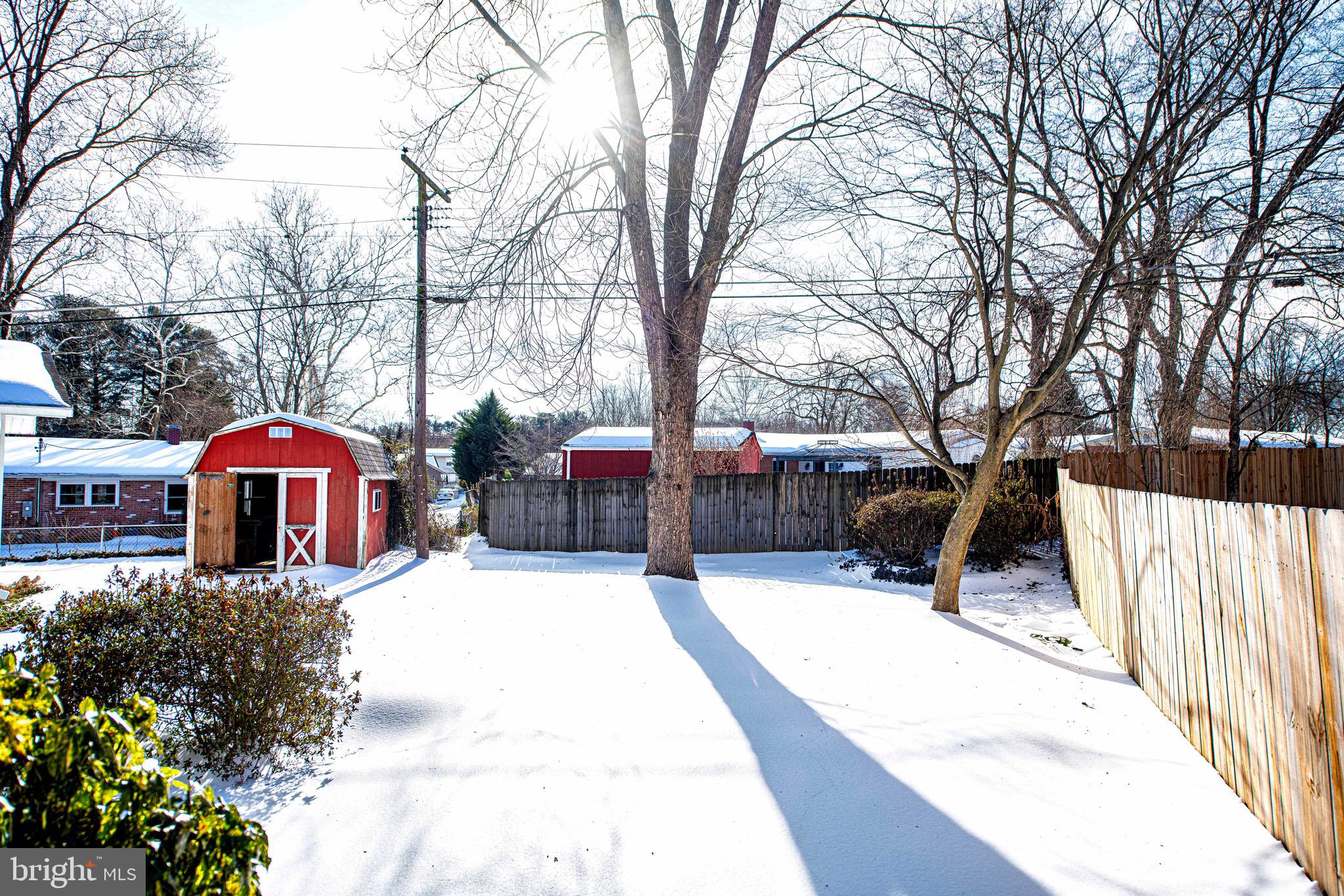 103 Chatham Road Bel Air, MD 21014 - Photo 18 of 21 a view of a white house with a yard covered in snow