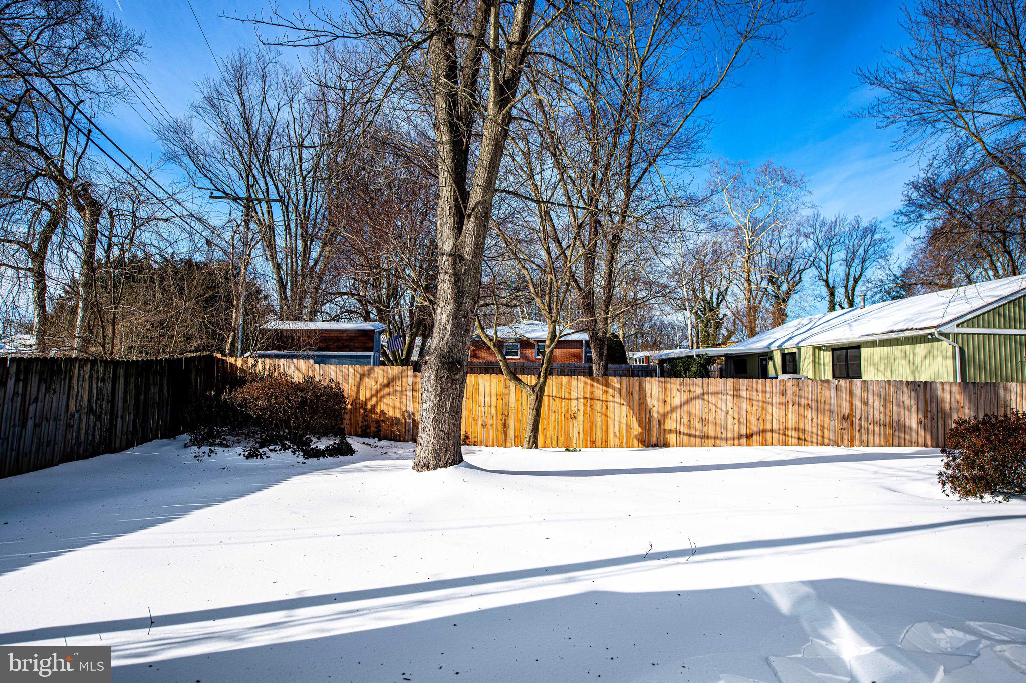 103 Chatham Road Bel Air, MD 21014 - Photo 19 of 21 a view of backyard with large tree and wooden fence
