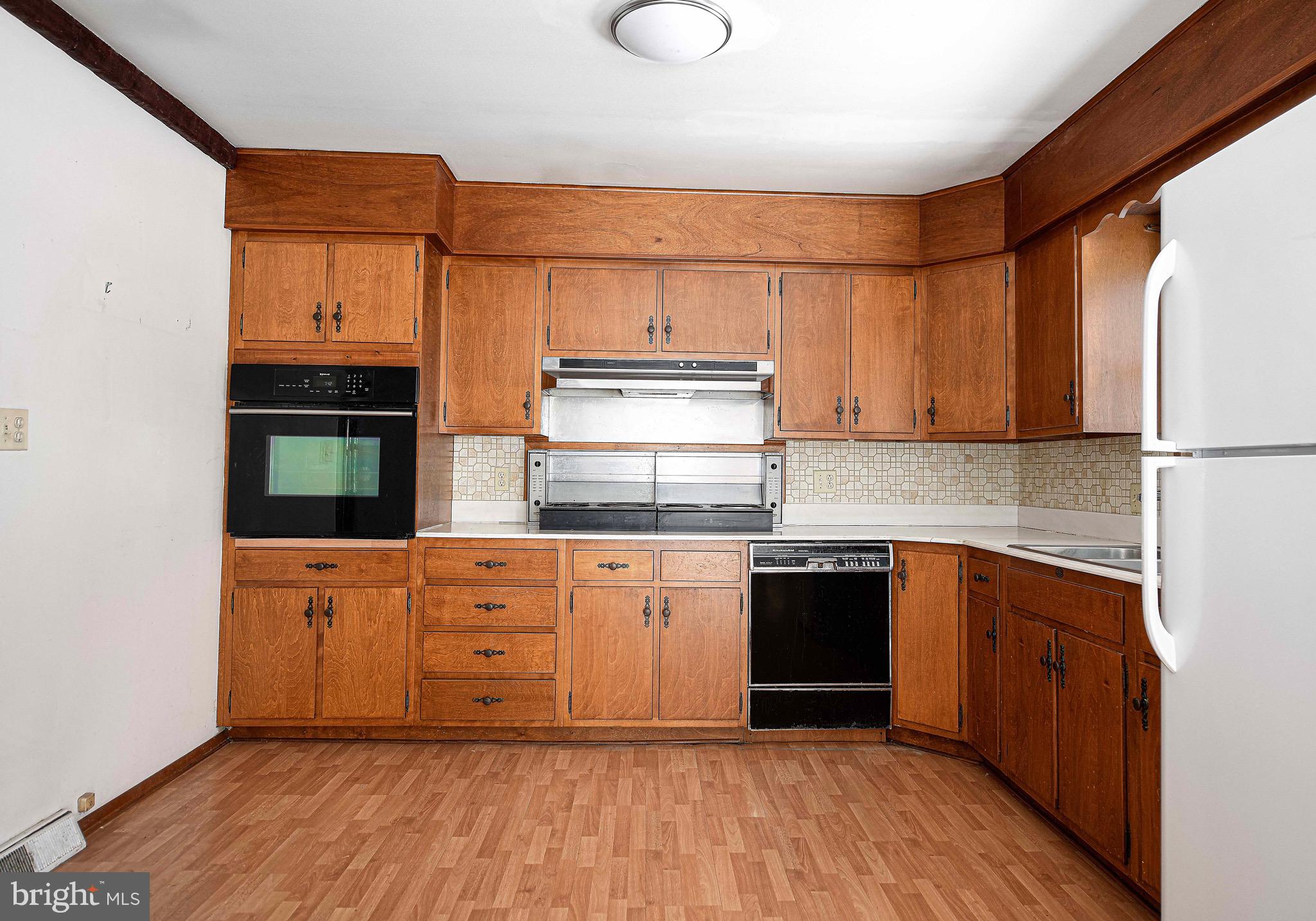 103 Chatham Road Bel Air, MD 21014 - Photo 7 of 21 a kitchen with stainless steel appliances granite countertop a stove a sink and a refrigerator