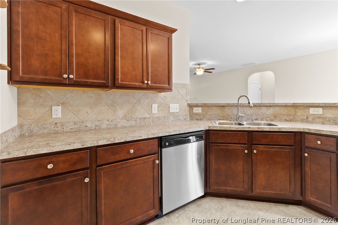 216 Meherrin Loop Raeford, NC 28376 - Photo 13 of 38 a kitchen with granite countertop cabinets sink and stove