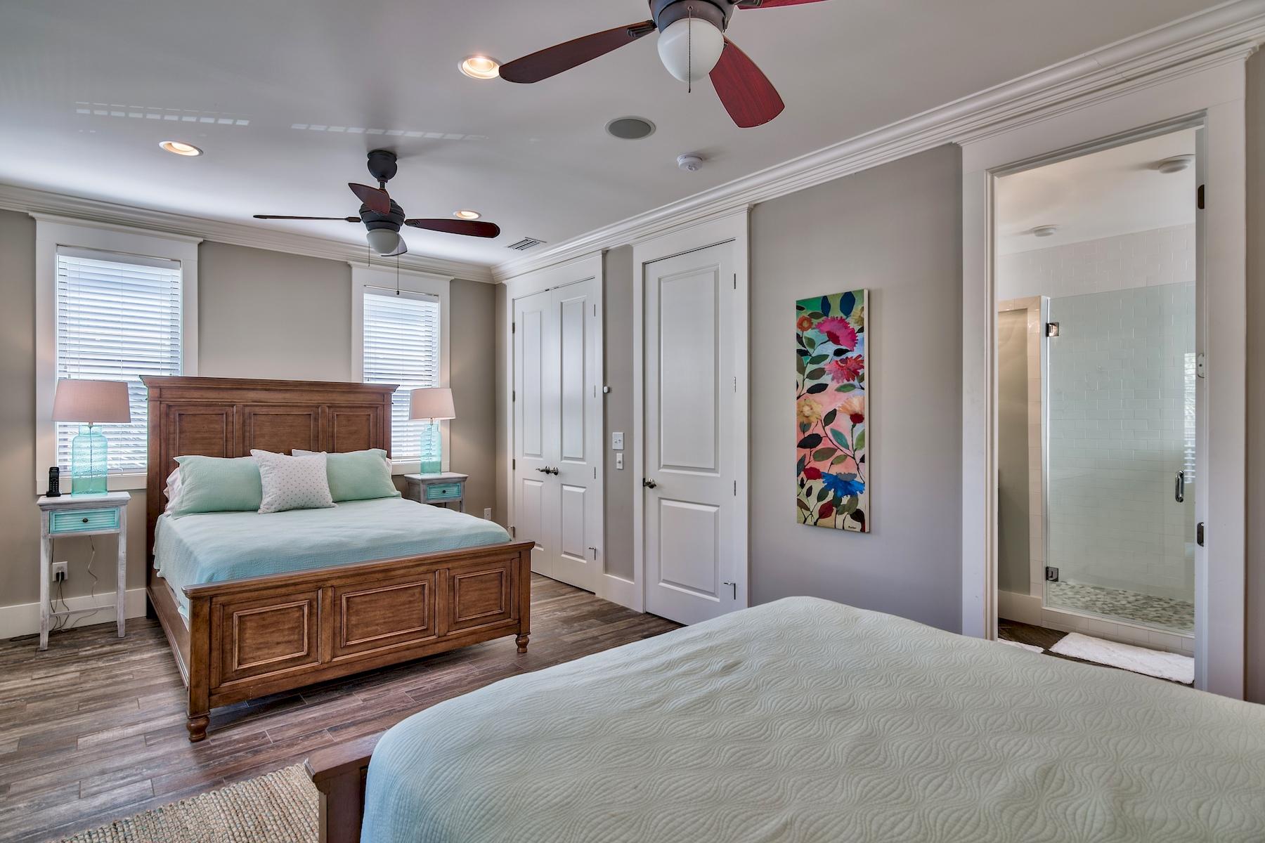 33 West Seacrest Beach Blvd Inlet Beach Inlet Beach, FL 32461 - Photo 21 of 53 a bedroom with a large bed and a chandelier